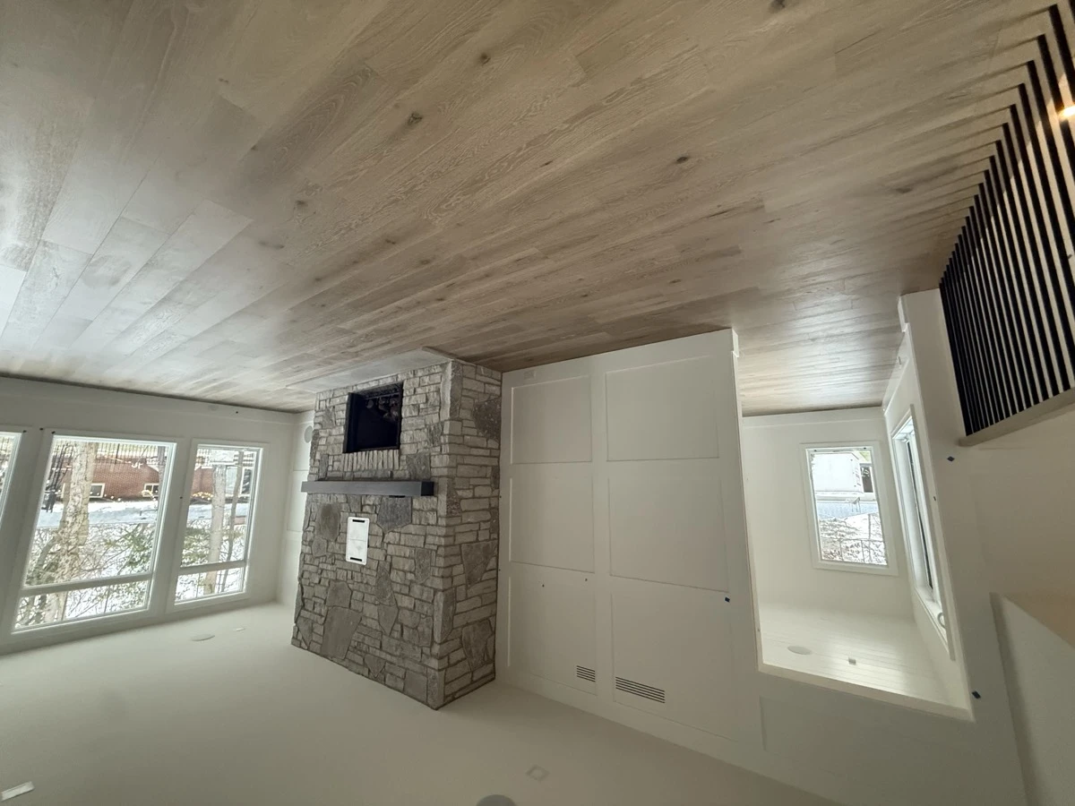 LVP ceiling and floor planking with stone fireplace