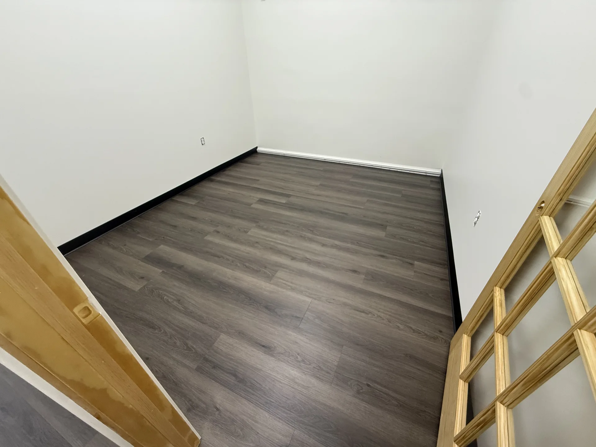 luxury vinyl flooring installed by BRC Flooring — finished basement