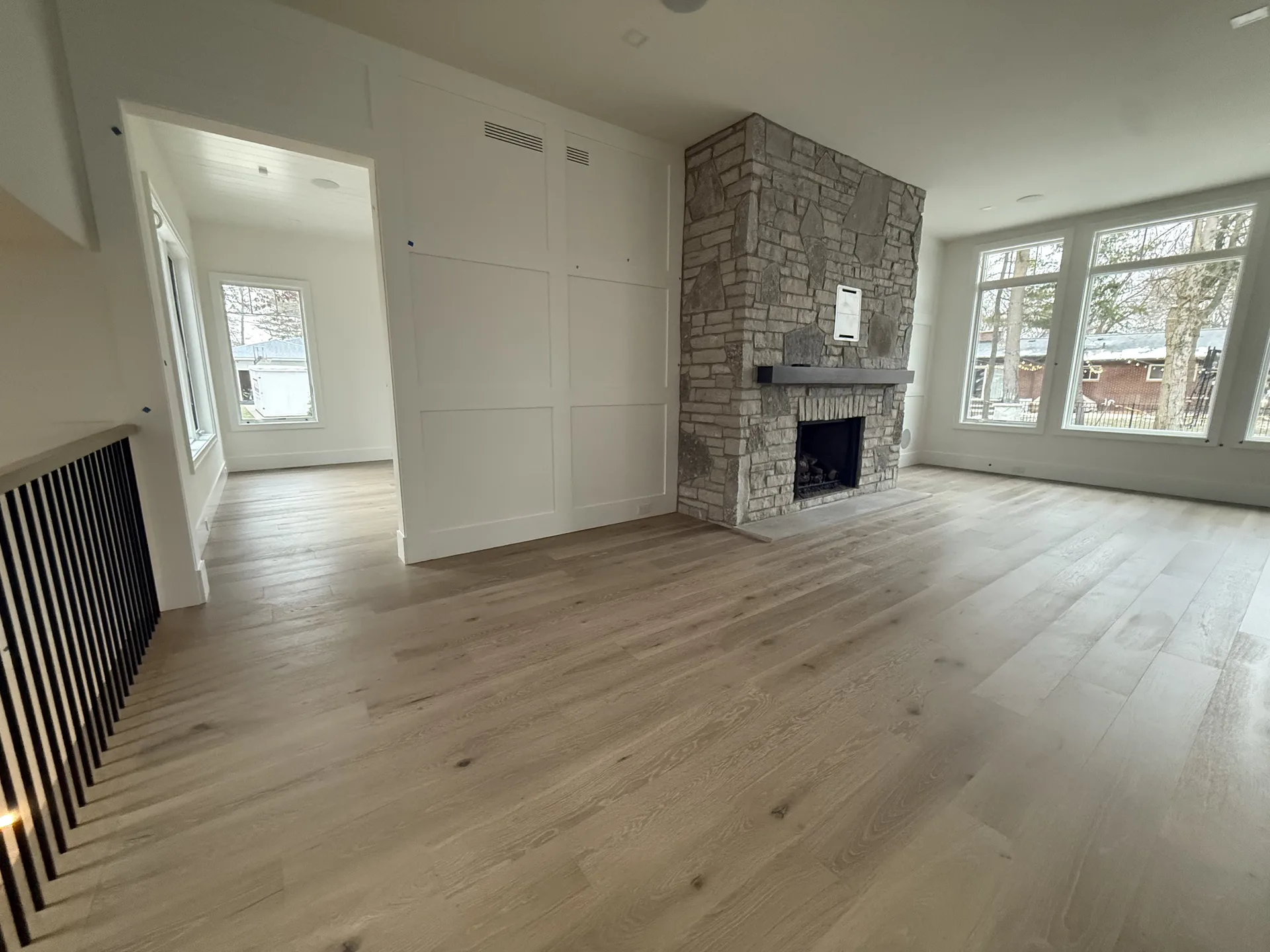 luxury vinyl flooring installed by BRC Flooring — living room · fireplace