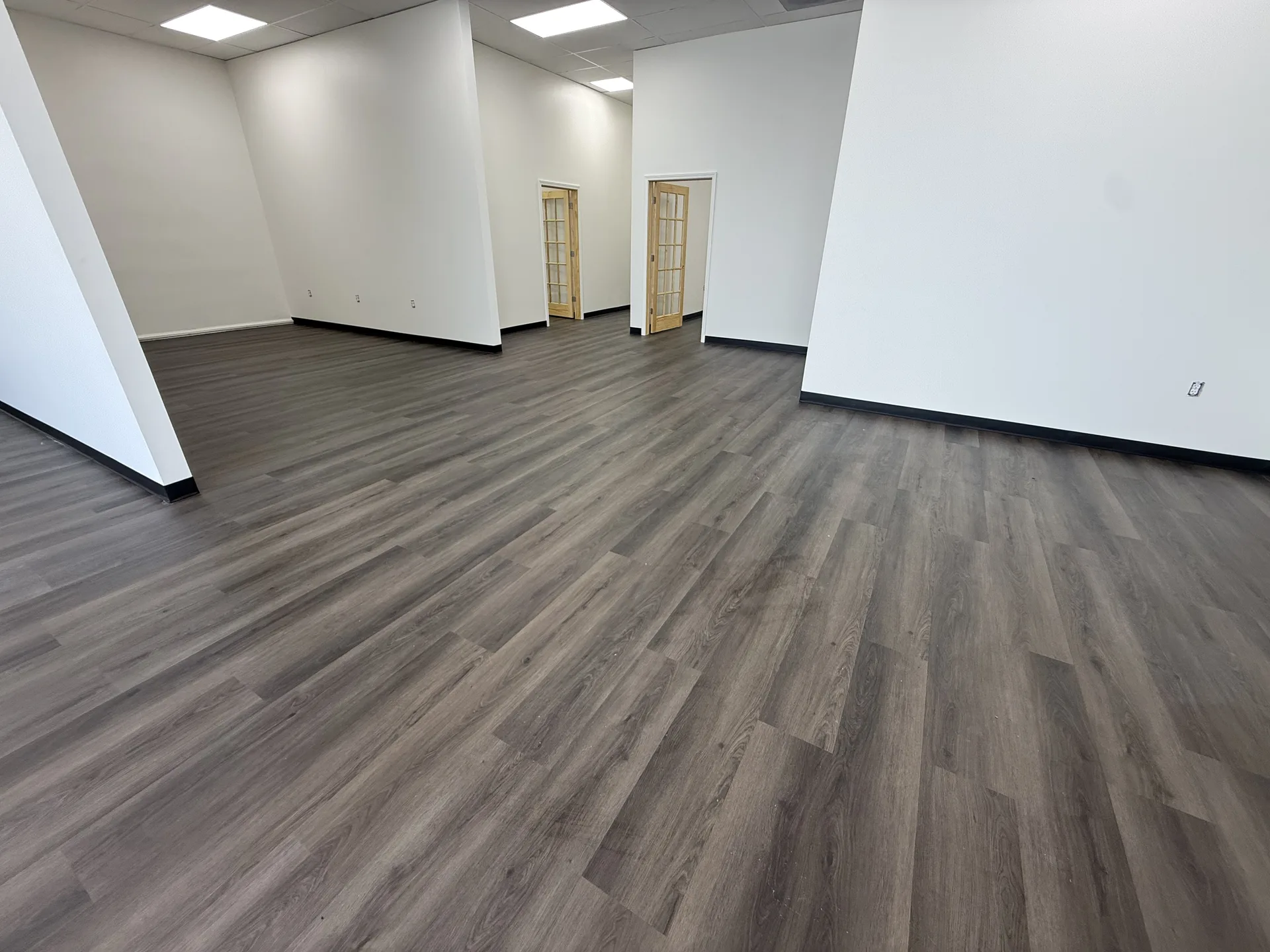 luxury vinyl flooring installed by BRC Flooring — finished basement