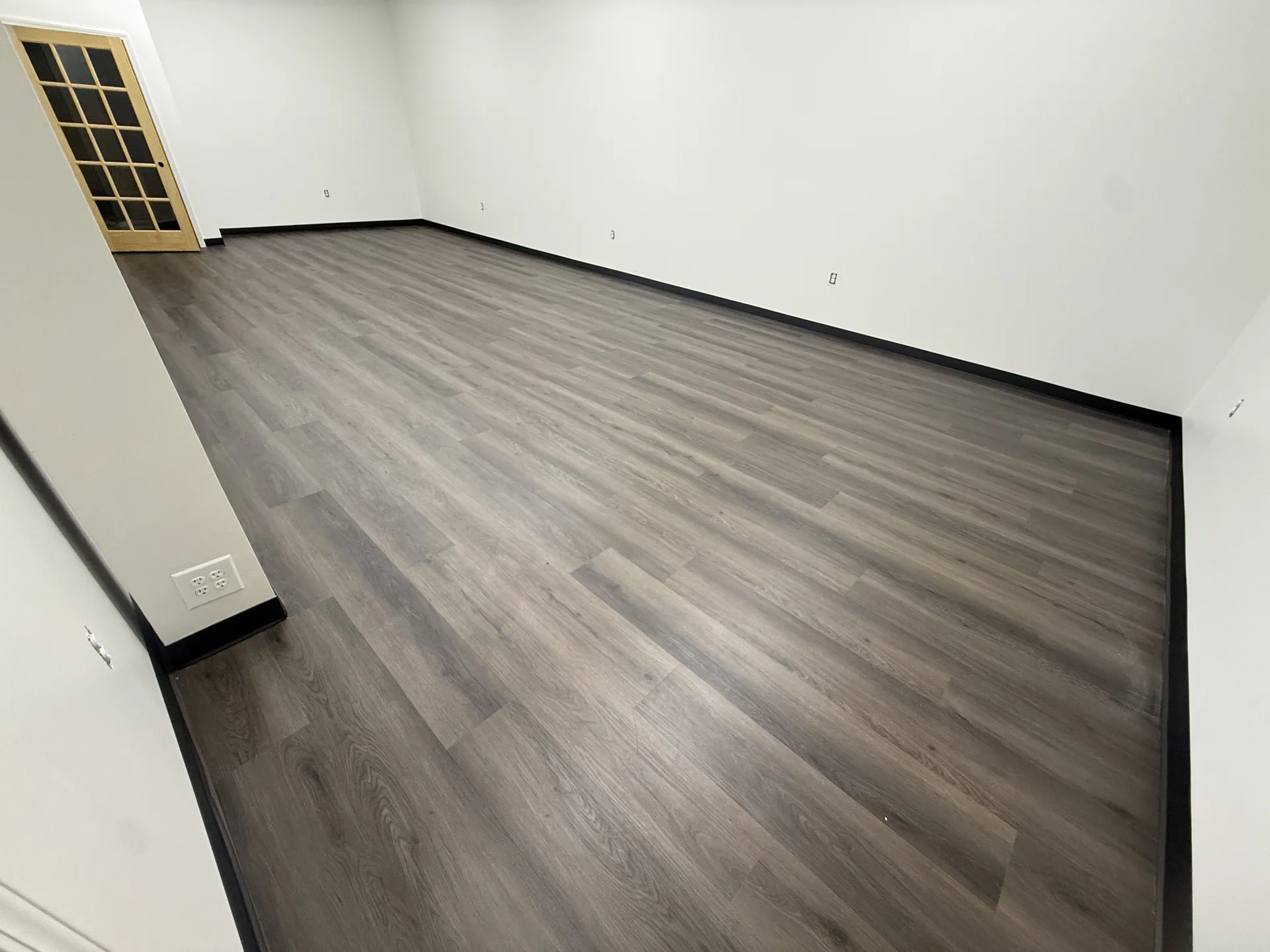 luxury vinyl flooring installed by BRC Flooring — finished basement