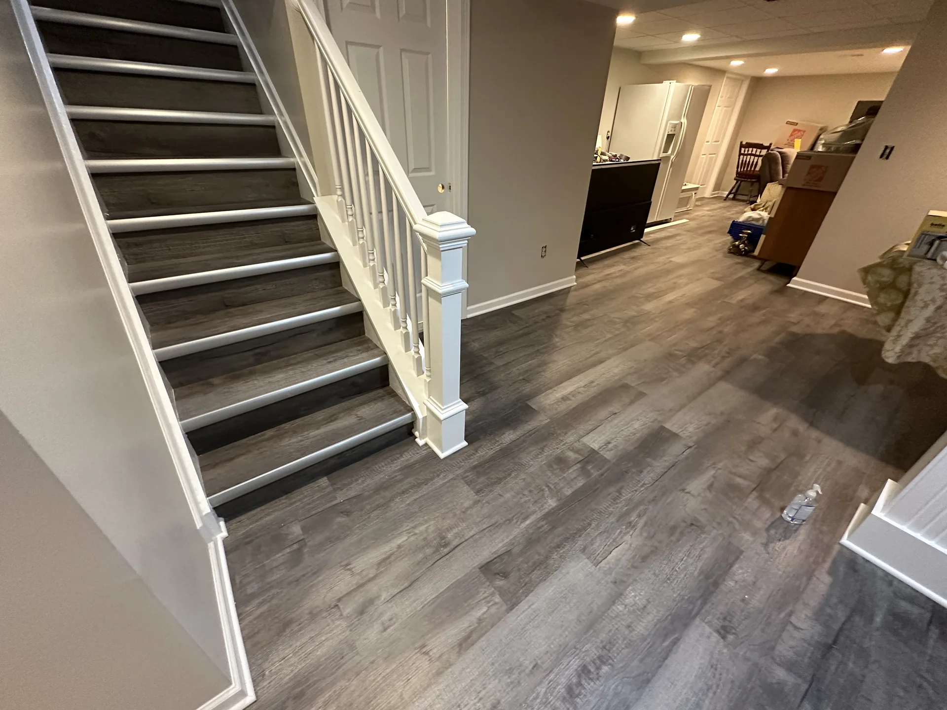 luxury vinyl flooring installed by BRC Flooring — staircase & hallway