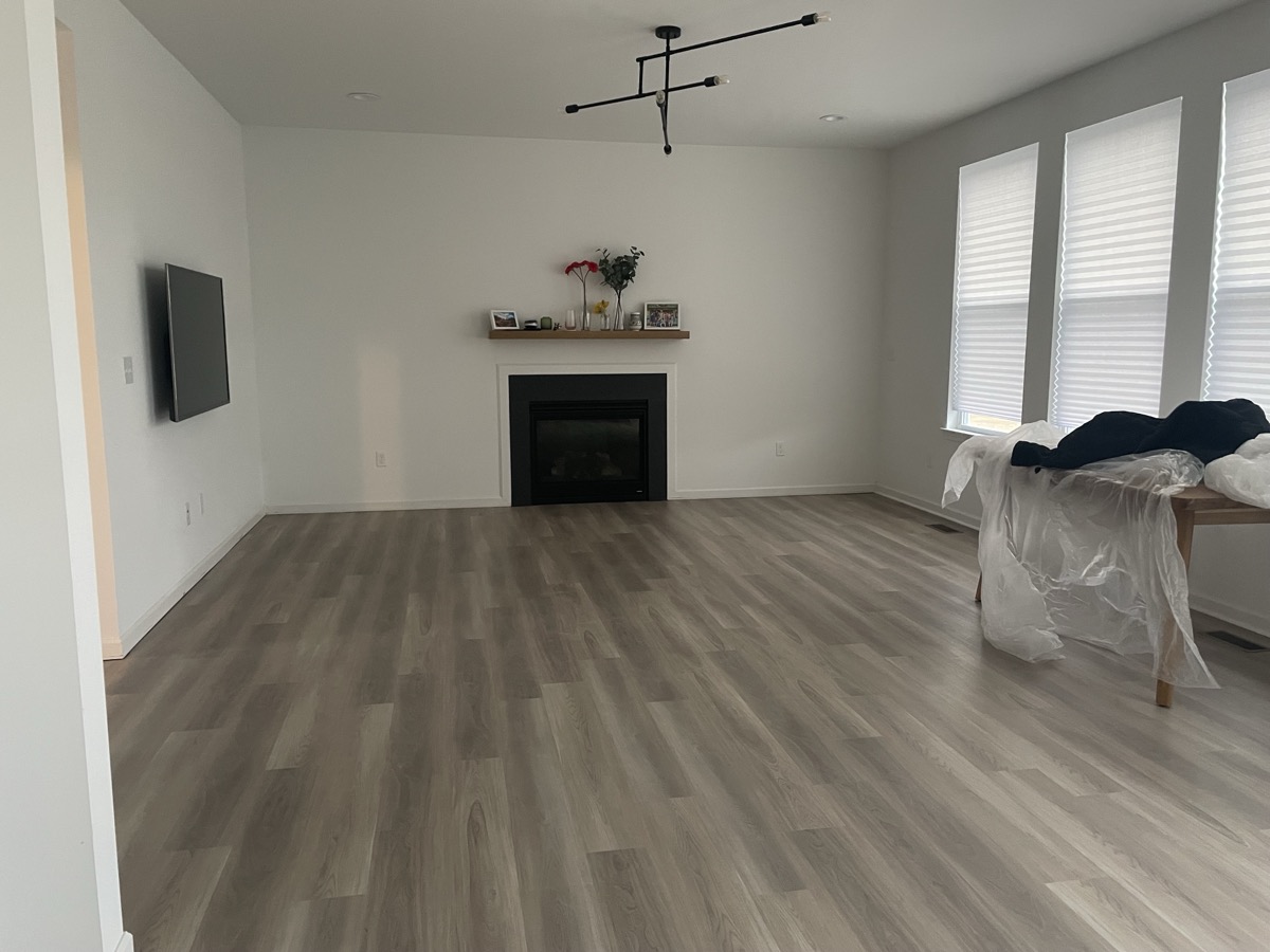 LVP flooring in living room with fireplace