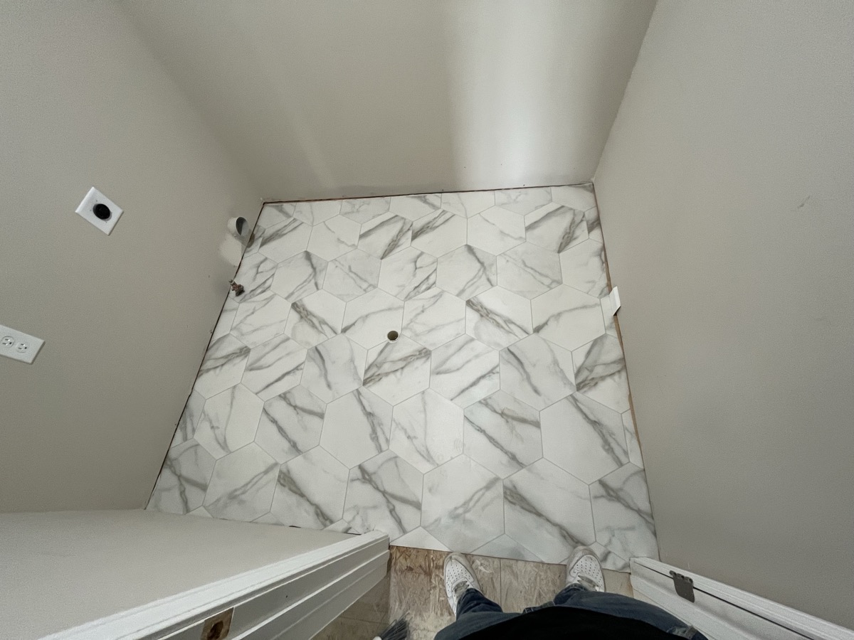 Marble hexagon tile bathroom floor